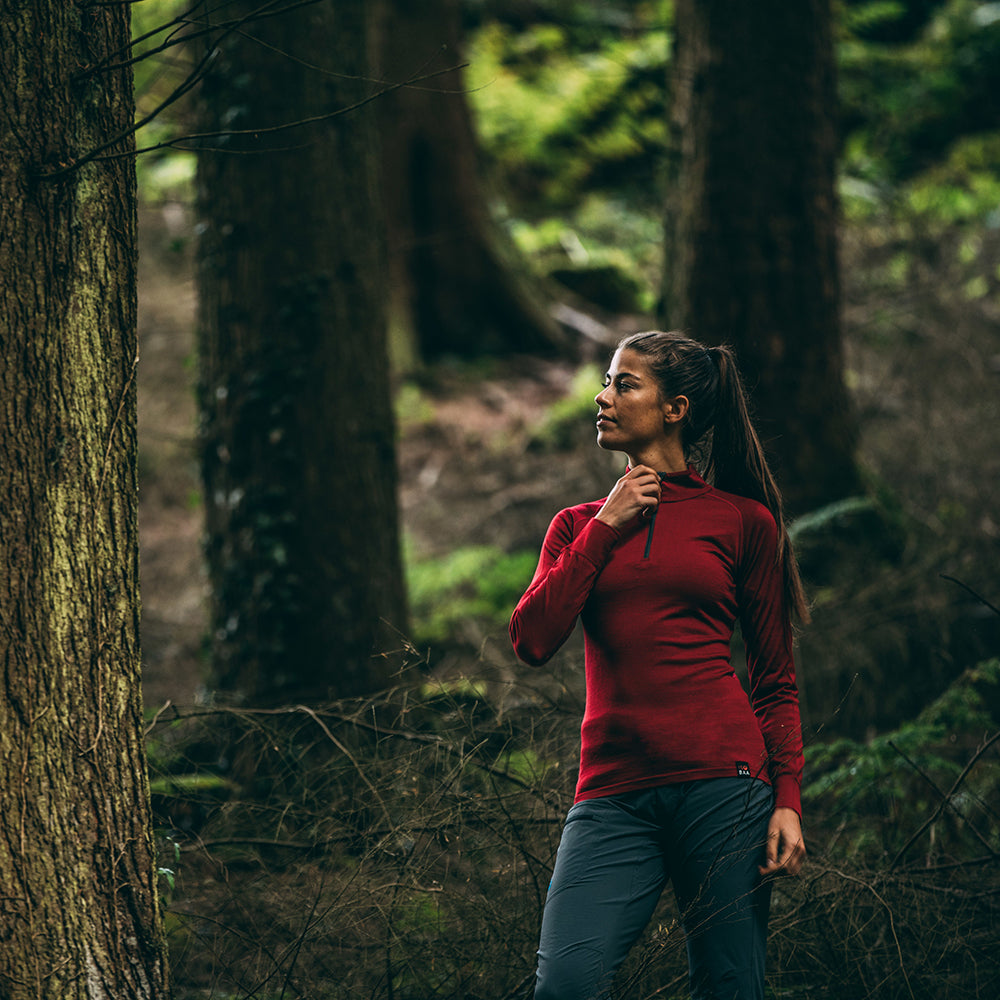 Isobaa | Womens Merino 200 Long Sleeve Zip Neck (Red) | Experience the best of 200gm Merino wool with this ultimate half-zip top – your go-to for challenging hikes, chilly bike commutes, post-workout layering, and unpredictable weather. | Model: Jess