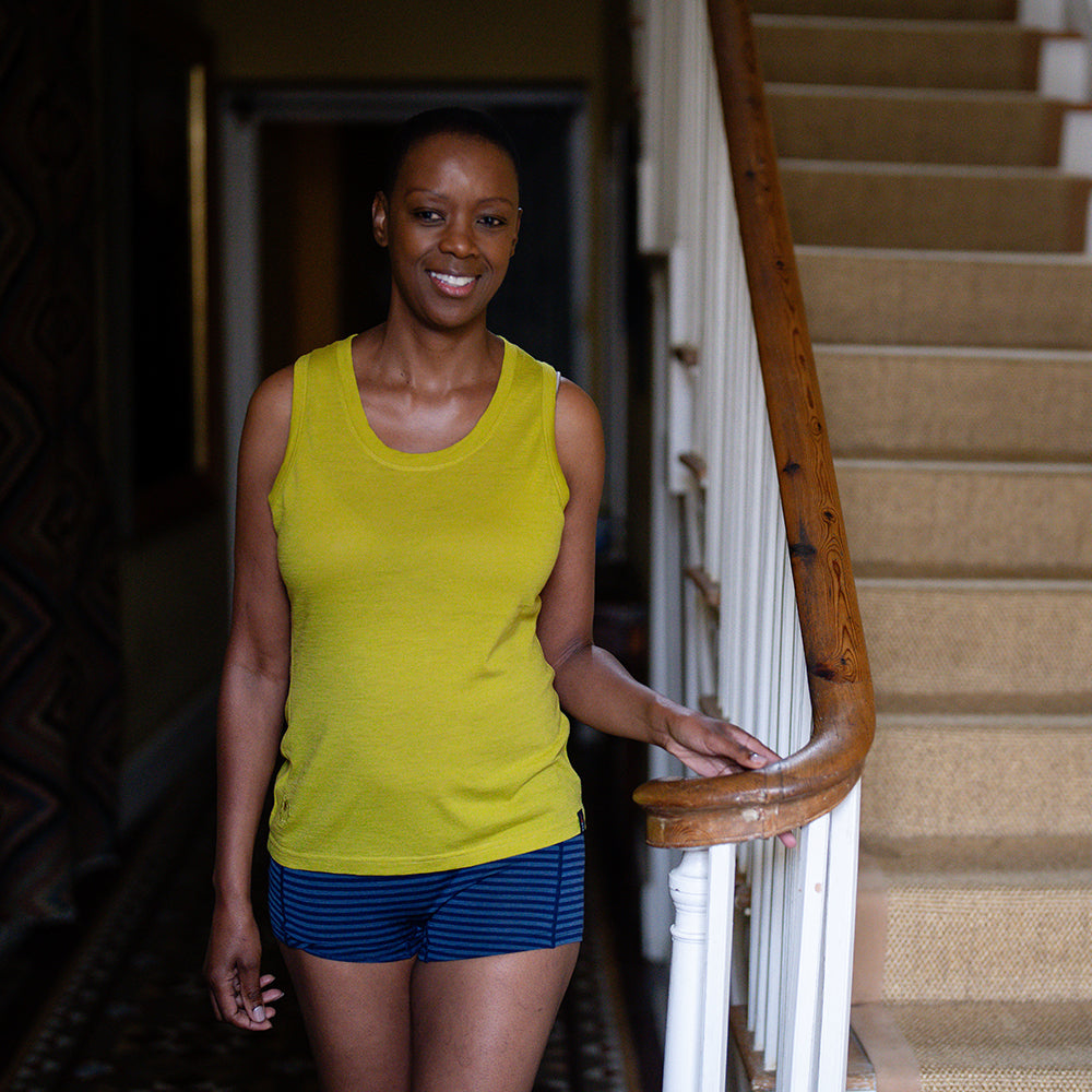 Isobaa | Womens Merino 150 Vest (Lime) | Be ready for any adventure with Isobaa's superfine Merino sleeveless Vest. | Model: Yolisa