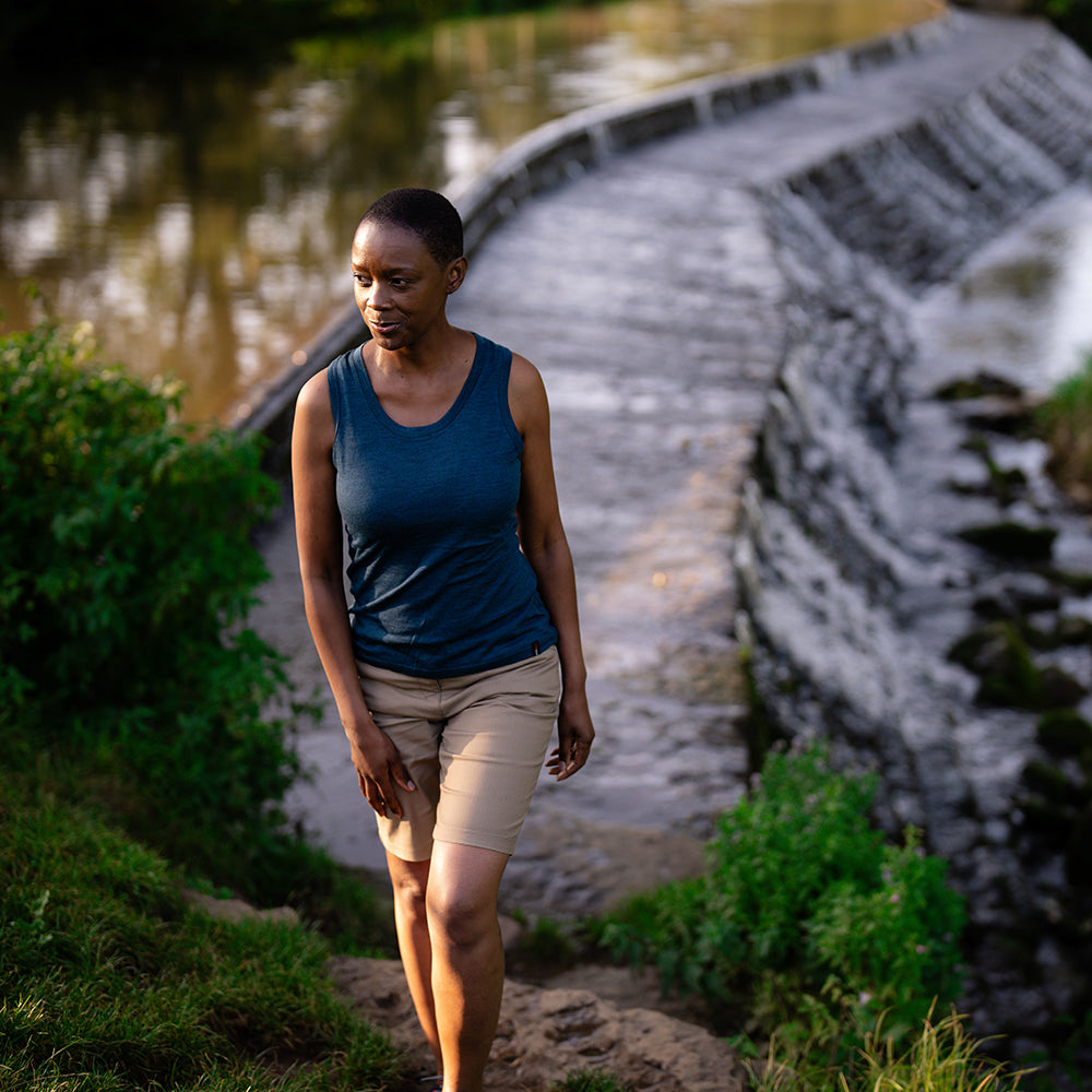 Isobaa | Womens Merino 150 Vest (Petrol) | Be ready for any adventure with Isobaa's superfine Merino sleeveless Vest. | Model: Yolisa