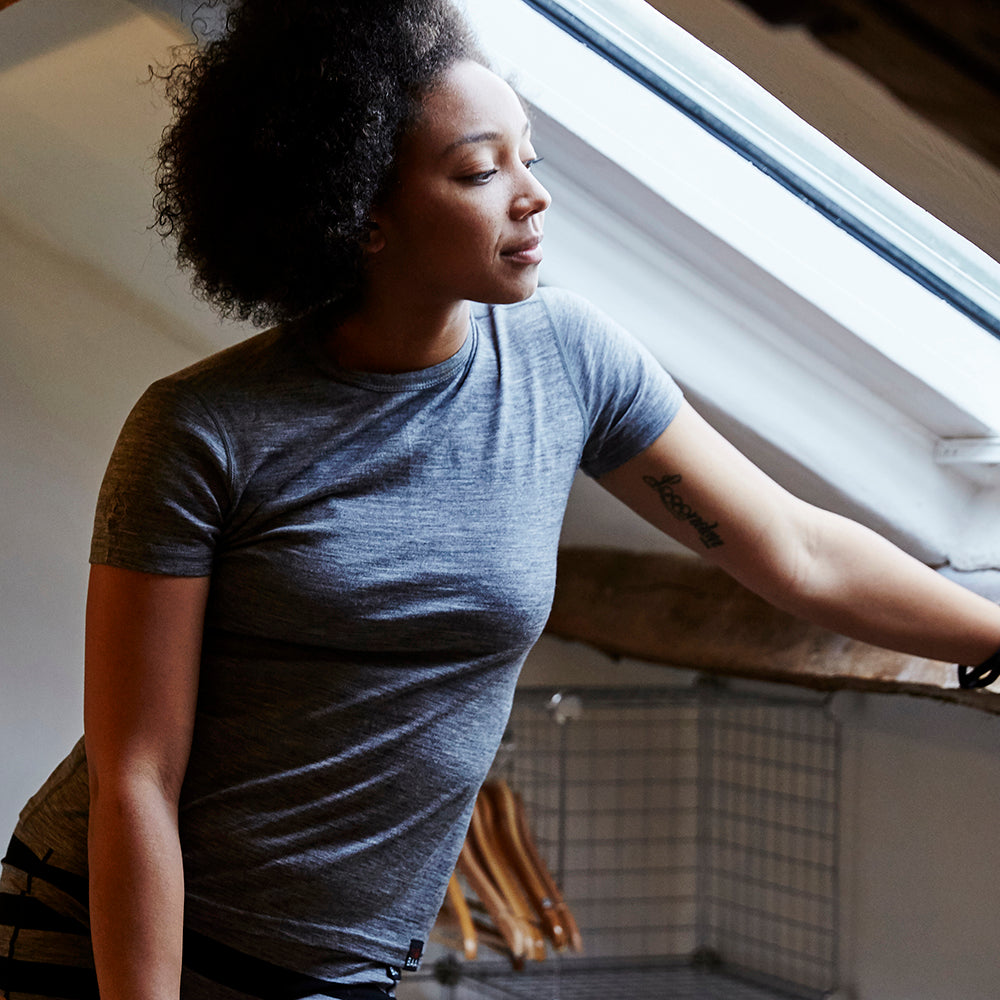 Isobaa | Womens Merino 150 Short Sleeve Crew (Charcoal) | Gear up for performance and comfort with Isobaa's technical Merino short-sleeved top. | Model: Savanah